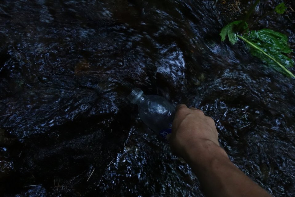  5:40am. Getting water out of a stream.&nbsp; 